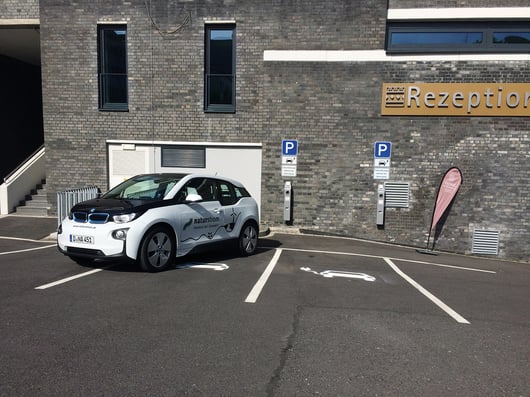 Electric car at charging station